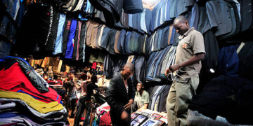 Man selling clothes photo in kenya