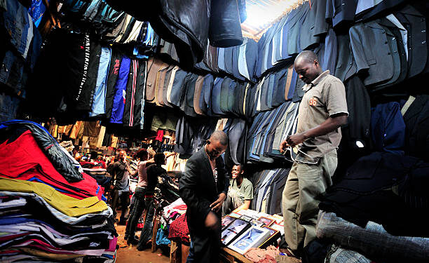 Man selling clothes photo in kenya