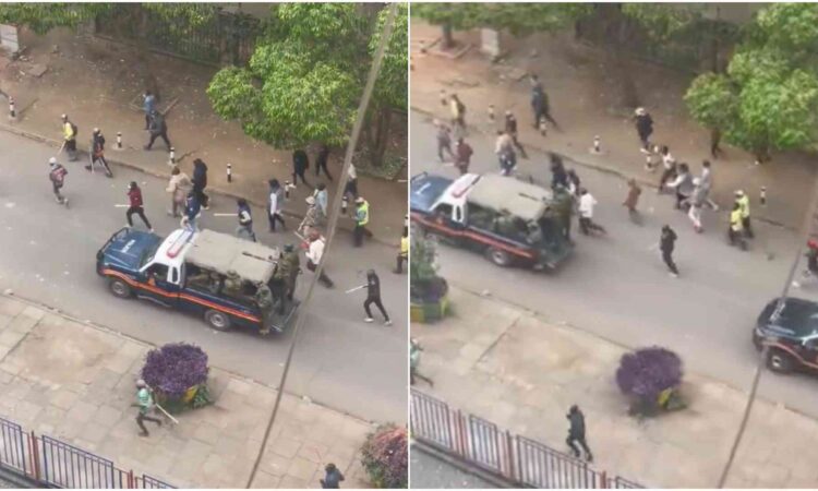 Masked police moving with goons photo
