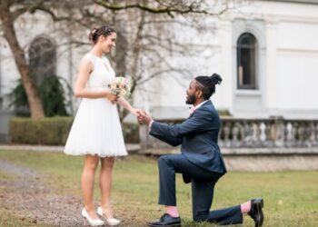 Wedding day as husband on knees