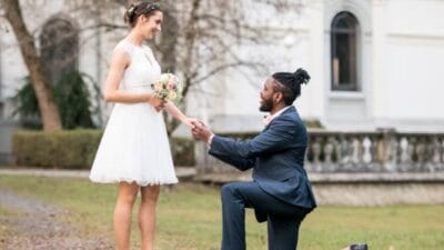 Wedding day as husband on knees