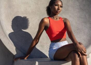 Young african australian teenage girl in urban location. cool attitude.
