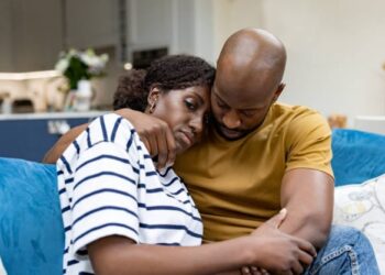 Man and wife cuddling photo
