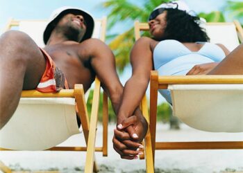 Man and woman photo breezing at the coast in kenya