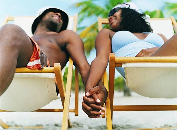 Man and woman photo breezing at the coast in kenya