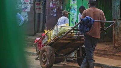 Man hawking water on the street photo
