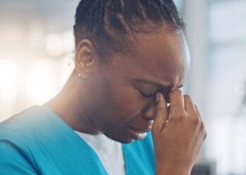 Woman crying in uganda photo