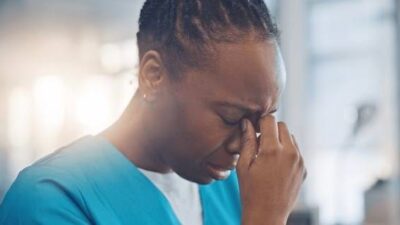 Woman crying in uganda photo