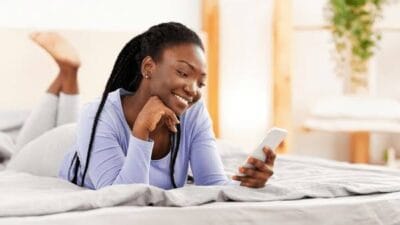 Woman looking at phone as husband searching for her photo