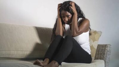 Woman scratching her head photo