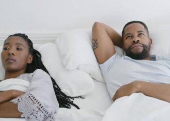 Man and woman thinking in bed free photo