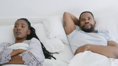 Man and woman thinking in bed free photo