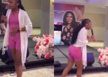 Gen z pastor aisha mwangi wearing biker while preaching photo