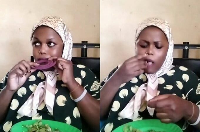 Mombasa woman chewing muguka with mosquito coil