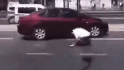 Uk muslim praying on a busy street