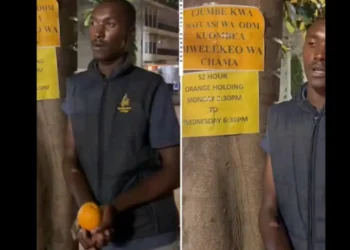 Man holding orange