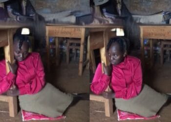 Tigania teacher hugging desk