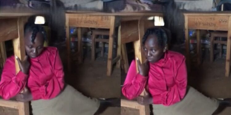 Tigania teacher hugging desk