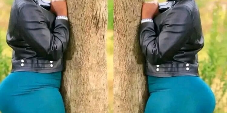 Woman Keroka Kisii hug tree