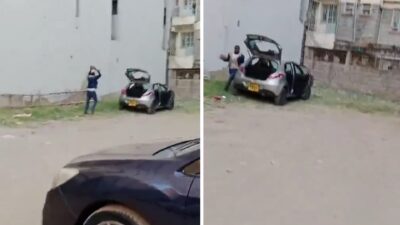 Kenyan woman records an alleged NIS agent vandalize