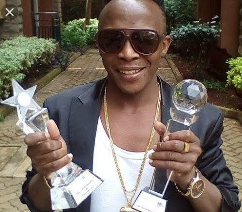 Papa dennis is dead Papa Dennis holding awards. PHOTO | STAR