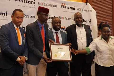 Kiharu Mp Ndindi Nyoro receiving an award from Mizani Africa. PHOTO | BMS