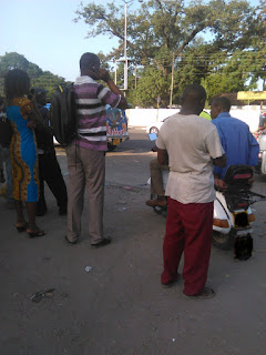 Stage chats. People on stage chatting as they wait for Matatus.