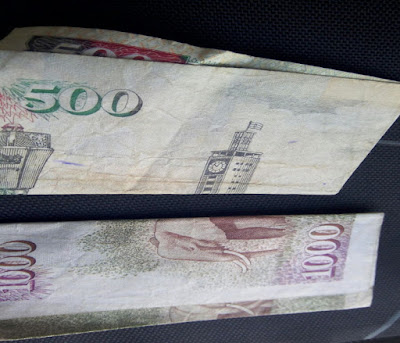 Corruption use money in any ways.[Photo : George]