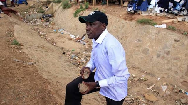Senator Boni Khalwale throwing stones