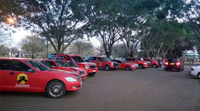 Jubilee red cars parked at Jubilee offices. PHOTO | Courtesy Capital FM 400 TukTuk, 100 Jubilee cars, 400 bodabodas set to ferry Jubilee supporters to vote for Uhuruto in Mombasa. -John Gatimu