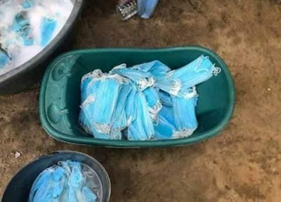 Mothers washing used facemasks for resale. PHOTO | BMS Mothers washing used facemasks for resale. PHOTO | BMS