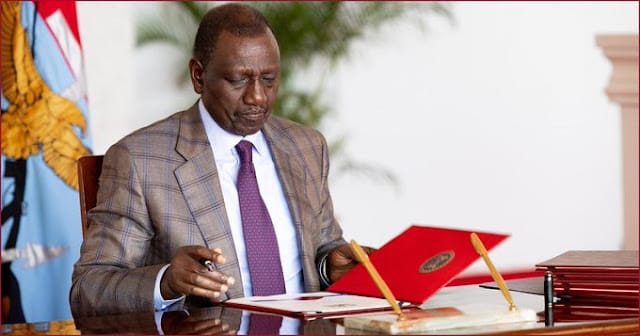 Kenya President William Ruto with loans book photo Kenya President William Ruto with loans book photo