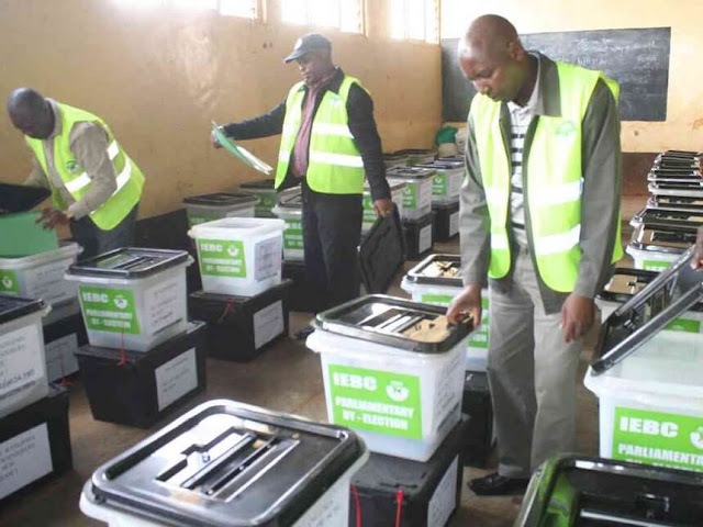 IEBC officials inspect ballot boxes at Muguru ACK Church hall ahead of their use at a Kangema polling station in the March 4, 2013 general elections. /JESSE MWANGI