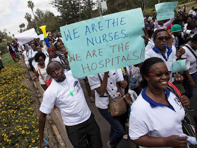 Nurses holding banners in a protest in Nairobi, Kenya June 12, 2017. REUTERS Nurses holding banners in a protest in Nairobi, Kenya June 12, 2017. REUTERS