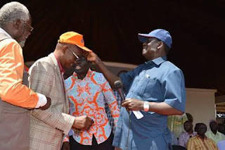Onyango Oloo welcomed by Hon. Raila Odinga in ODM. PHOTO| ODONGO RODGERS. Onyango Oloo attacks Jubilee and threatens to spoil beans over IEBC rigging Strategies.