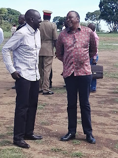 President Kenyatta shared a joke with his deputy in Nyamira, Kisii. PHOTO | Courtesy PSCU
