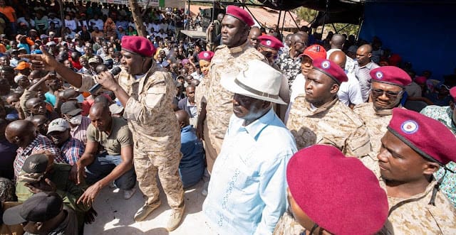 Raila Odinga introduces rebel youth movement for the defense of democracy in a military uniform