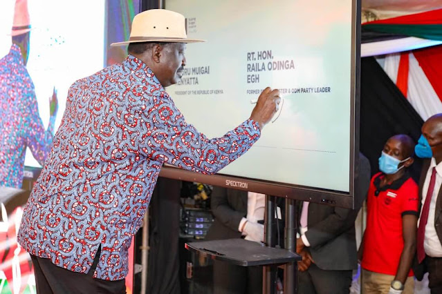 ODM boss Raila Odinga with President Uhuru Kenyatta on signature collection