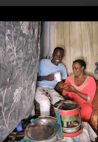Manzi wa Kibra with a man in her house