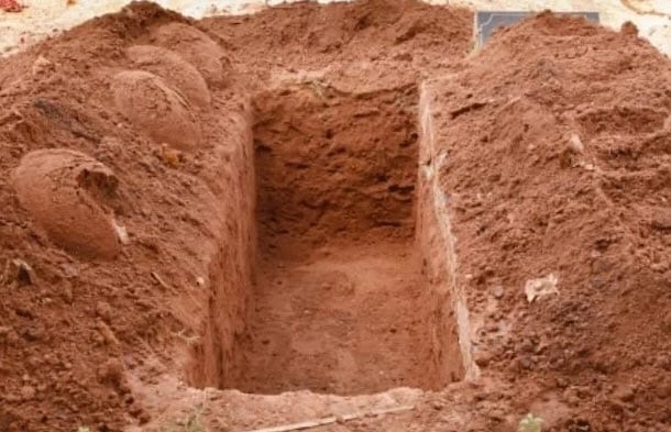 Police officers in Milaani, Masinga grave