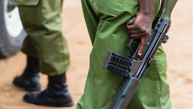 Police officer with a gun in Kenya Police officer with a gun in Kenya